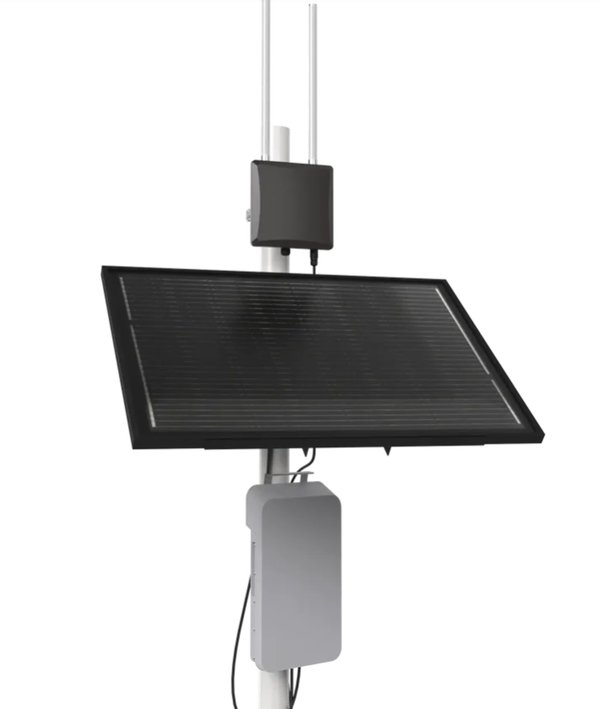 A gateway on a pole with a solar panel